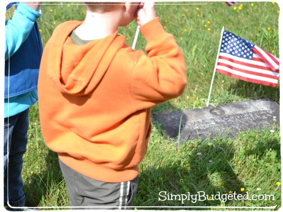 Kids putting out flags for Memorial Day